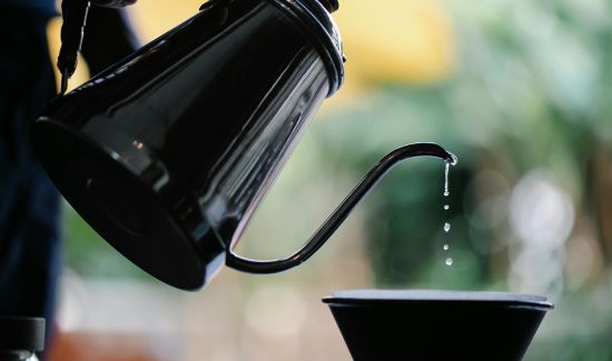 Pouring Boiled Water into Coffee